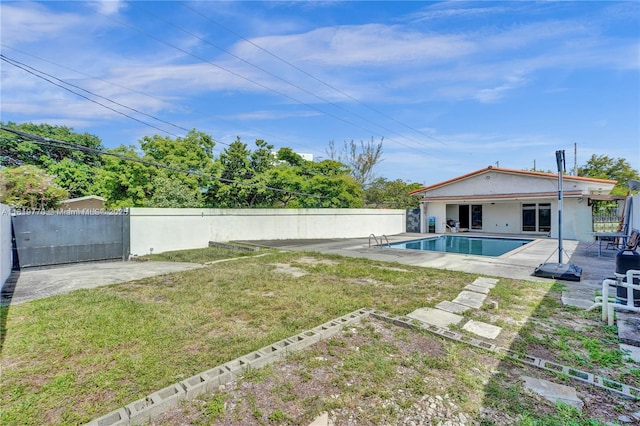 100 NW 23rd Ave, Miami, FL 33125 - fenced backyard featuring a patio area