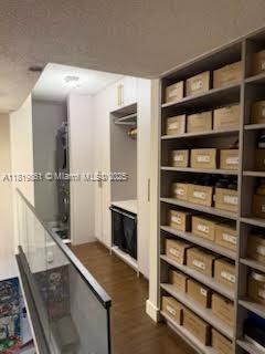 9367 Fontainebleau Blvd Unit G237, Miami, FL 33172 - hallway with dark wood finished floors