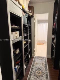 9367 Fontainebleau Blvd Unit G237, Miami, FL 33172 - walk in closet with dark wood-style floors