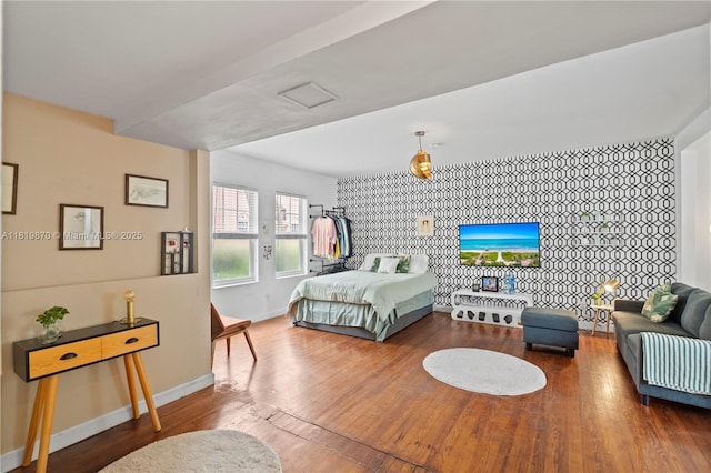760 Meridian Ave Unit 3, Miami Beach, FL 33139 - bedroom with baseboards, wood finished floors, and an accent wall