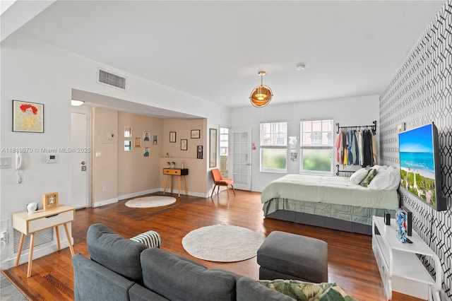760 Meridian Ave Unit 3, Miami Beach, FL 33139 - bedroom featuring wood finished floors, baseboards, and wallpapered walls