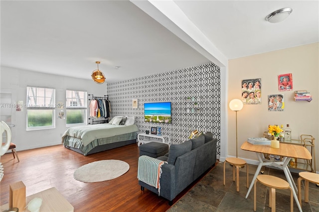 760 Meridian Ave Unit 3, Miami Beach, FL 33139 - bedroom featuring an accent wall and baseboards