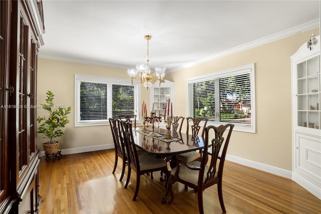 1270 Mariola Ct, Coral Gables, FL 33134 - dining room featuring a chandelier, baseboards, light wood-type flooring, and ornamental molding