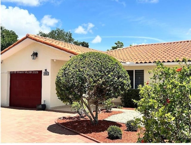 6231 SW 27th St, Miami, FL 33155 - mediterranean / spanish-style house featuring stucco siding, a tiled roof, and a garage