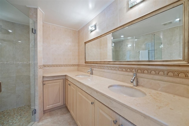 6231 SW 27th St, Miami, FL 33155 - full bathroom featuring tile walls, a shower stall, double vanity, and tile patterned flooring
