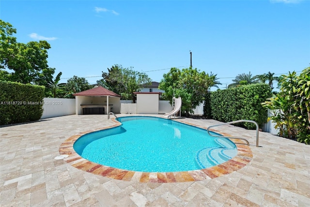 6231 SW 27th St, Miami, FL 33155 - view of swimming pool with a water slide and a patio