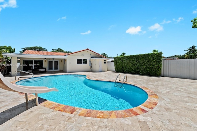 6231 SW 27th St, Miami, FL 33155 - view of swimming pool with a water slide, french doors, a patio area, and ceiling fan