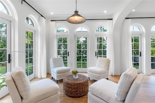 sitting room featuring healthy amount of natural light, recessed lighting, and light wood-style flooring
