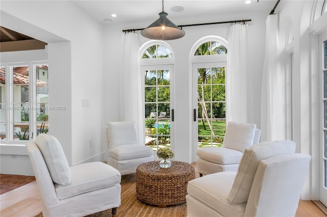 living area with recessed lighting and light wood-style floors