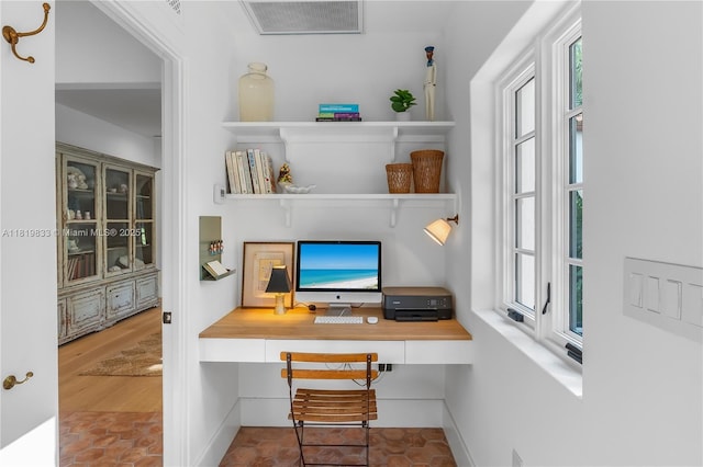 office area featuring built in study area