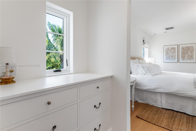 bedroom with light wood-style floors