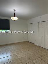 8888 Collins Ave Unit 318, Surfside, FL 33154 - unfurnished room featuring tile patterned flooring and baseboards