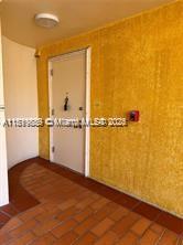 8888 Collins Ave Unit 318, Surfside, FL 33154 - unfurnished room with brick patterned flooring