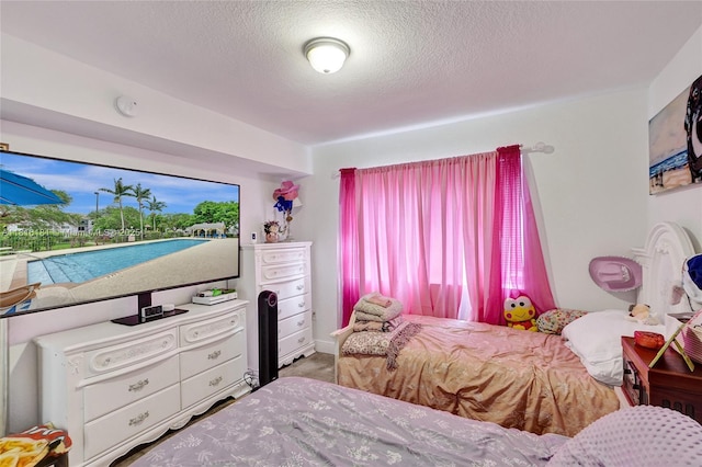 15400 SW 284th St Unit 1204, Homestead, FL 33033 - bedroom with a textured ceiling