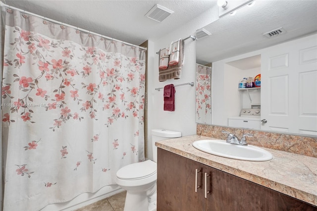 15400 SW 284th St Unit 1204, Homestead, FL 33033 - full bathroom with washer / clothes dryer, vanity, tile patterned flooring, a textured ceiling, and a shower with shower curtain
