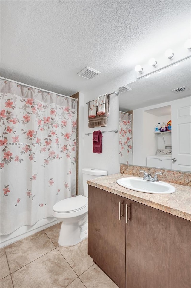 15400 SW 284th St Unit 1204, Homestead, FL 33033 - full bathroom featuring vanity, tile patterned floors, washer / dryer, a textured ceiling, and a shower with shower curtain
