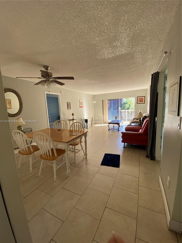 9301 SW 92nd Ave Unit A320, Miami, FL 33176 - dining room featuring a textured ceiling, light tile patterned floors, a ceiling fan, and baseboards
