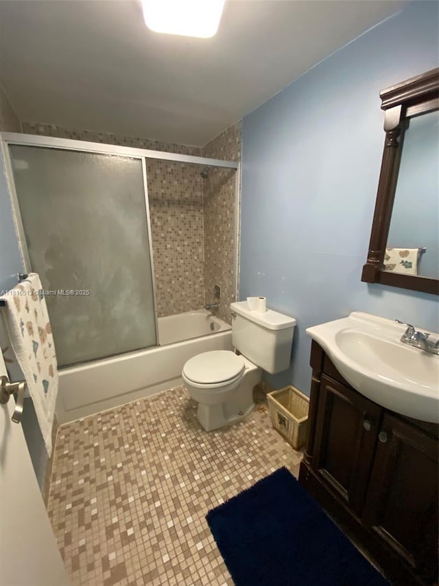 9301 SW 92nd Ave Unit A320, Miami, FL 33176 - full bathroom featuring toilet, vanity, combined bath / shower with glass door, and tile patterned floors