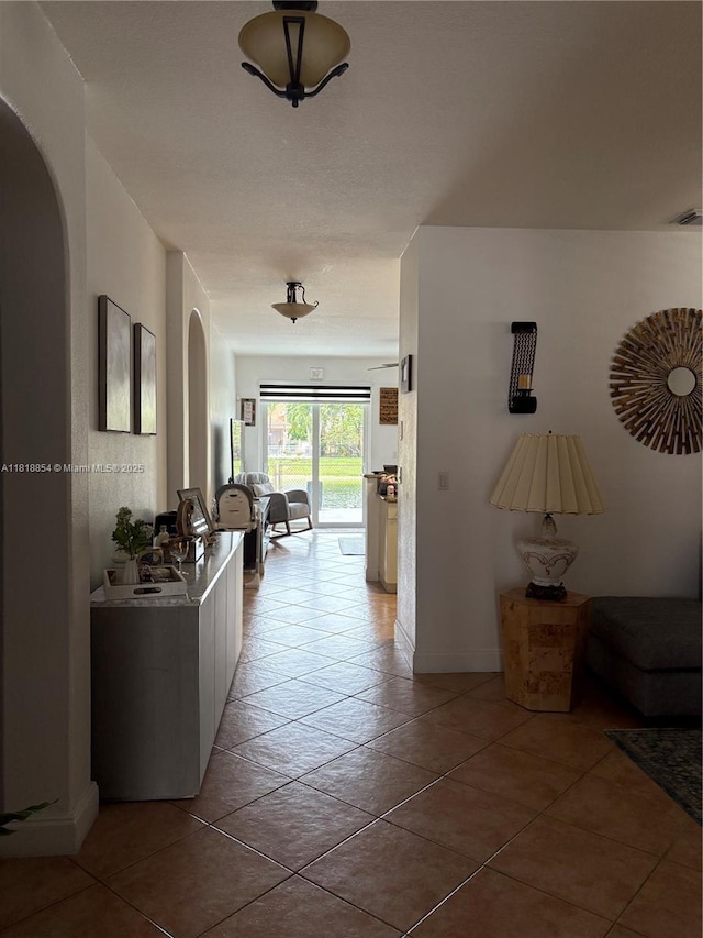 16419 SW 84th St, Miami, FL 33193 - corridor with arched walkways and light tile patterned floors