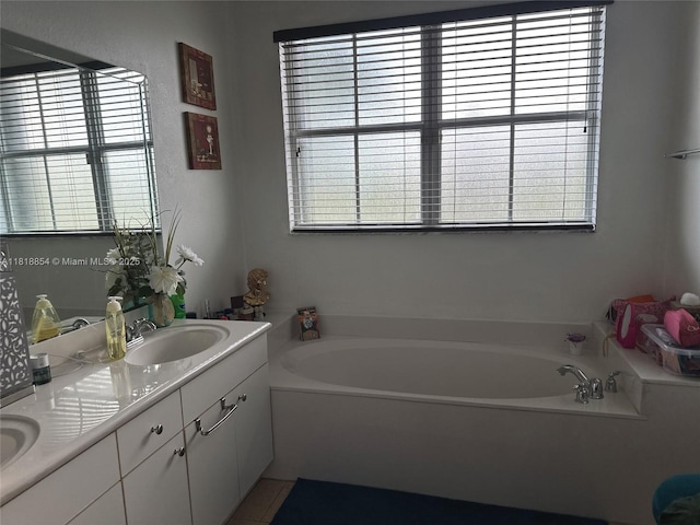 16419 SW 84th St, Miami, FL 33193 - full bathroom featuring healthy amount of natural light, double vanity, and a bath