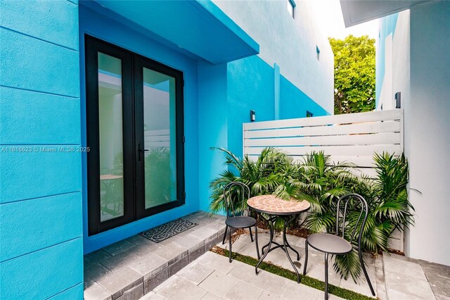 3645 SW 3rd St, Miami, FL 33135 - balcony featuring french doors and a patio area