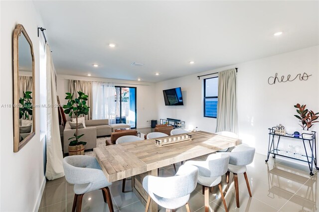 3645 SW 3rd St, Miami, FL 33135 - tiled dining area featuring plenty of natural light, baseboards, and recessed lighting