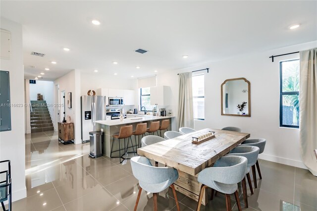 3645 SW 3rd St, Miami, FL 33135 - dining area with light tile patterned flooring, recessed lighting, and baseboards