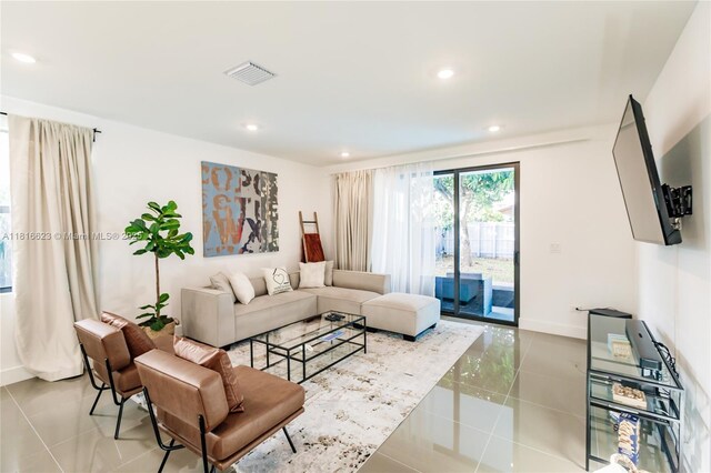 3645 SW 3rd St, Miami, FL 33135 - tiled living room featuring baseboards and recessed lighting