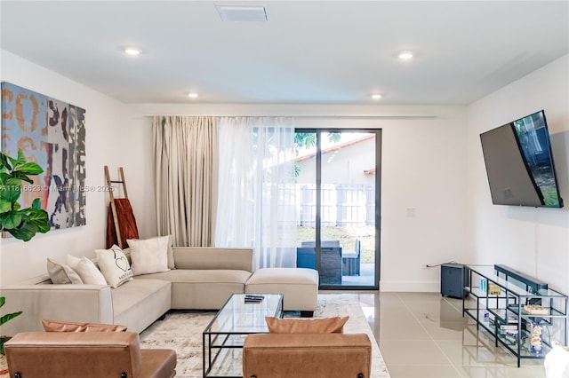 3645 SW 3rd St, Miami, FL 33135 - living room with light tile patterned flooring, recessed lighting, and baseboards
