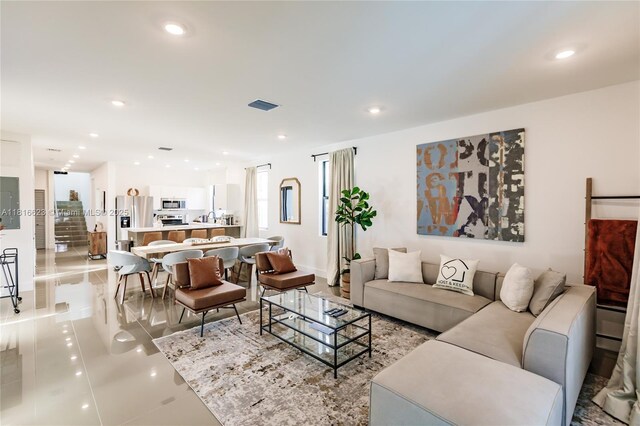 3645 SW 3rd St, Miami, FL 33135 - living area with recessed lighting, light tile patterned floors, and baseboards