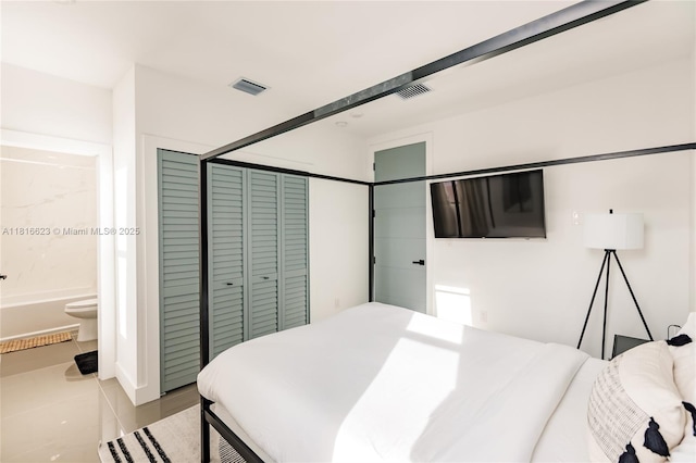 3645 SW 3rd St, Miami, FL 33135 - tiled bedroom with a closet and connected bathroom