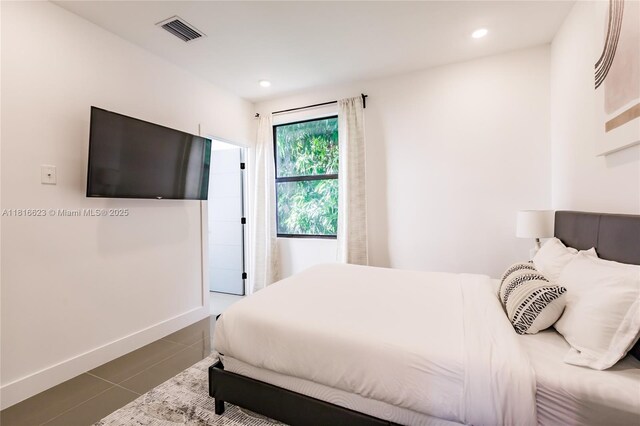 3645 SW 3rd St, Miami, FL 33135 - bedroom with dark tile patterned floors, baseboards, and recessed lighting