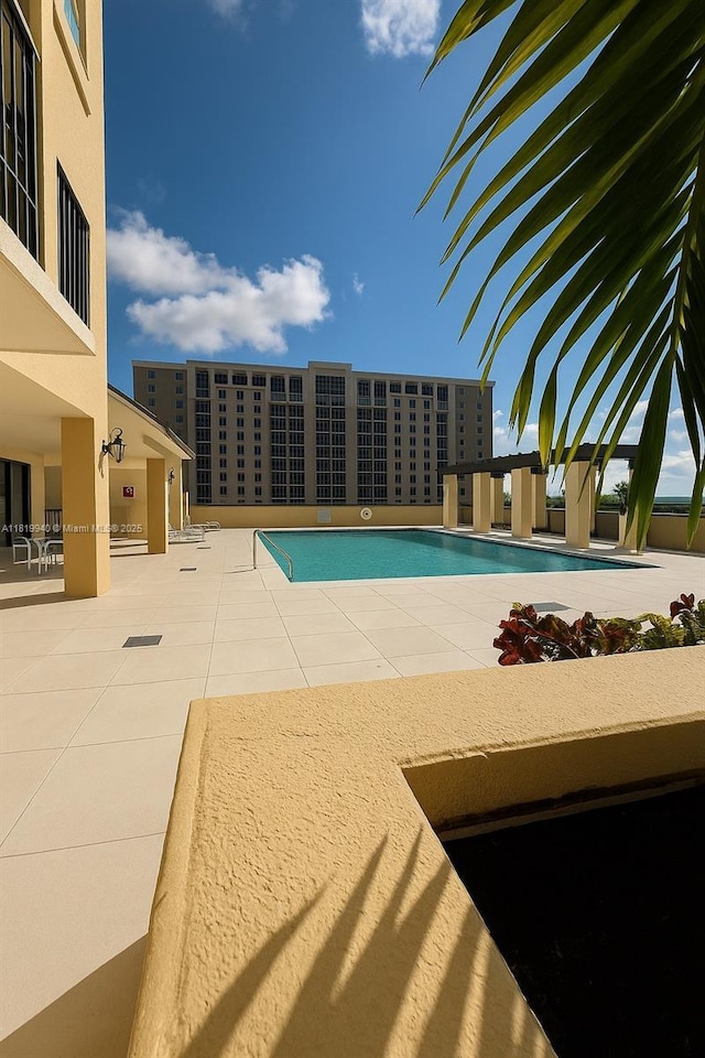4242 NW 2nd St Unit 807, Miami, FL 33126 - community pool featuring a patio