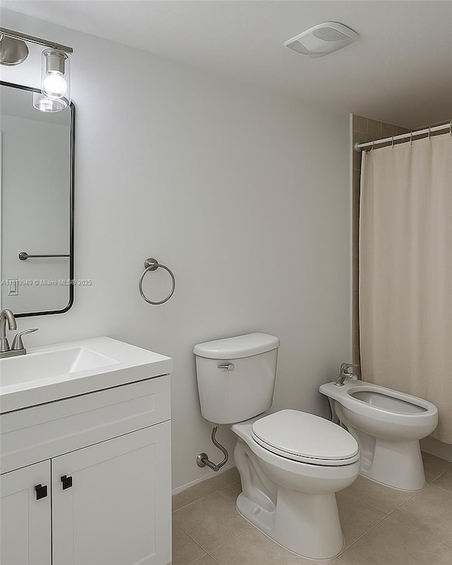 4242 NW 2nd St Unit 807, Miami, FL 33126 - full bathroom with tile patterned floors, a bidet, toilet, vanity, and a shower with curtain