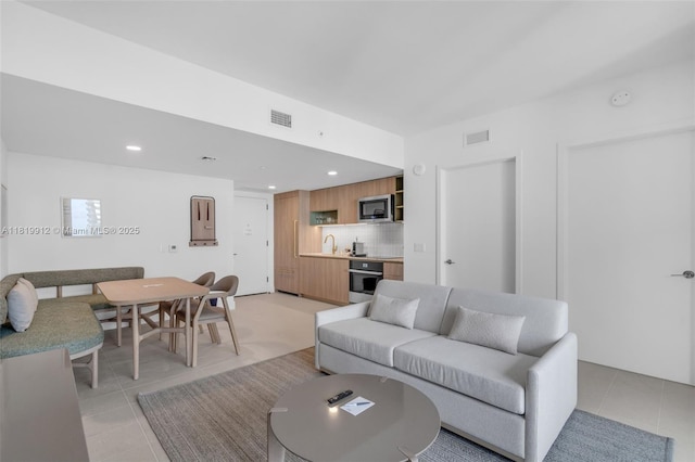 601 NE 6th St Unit 3709, Miami, FL 33132 - living area featuring light tile patterned floors and recessed lighting