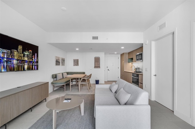 601 NE 6th St Unit 3709, Miami, FL 33132 - living area with light tile patterned floors and recessed lighting