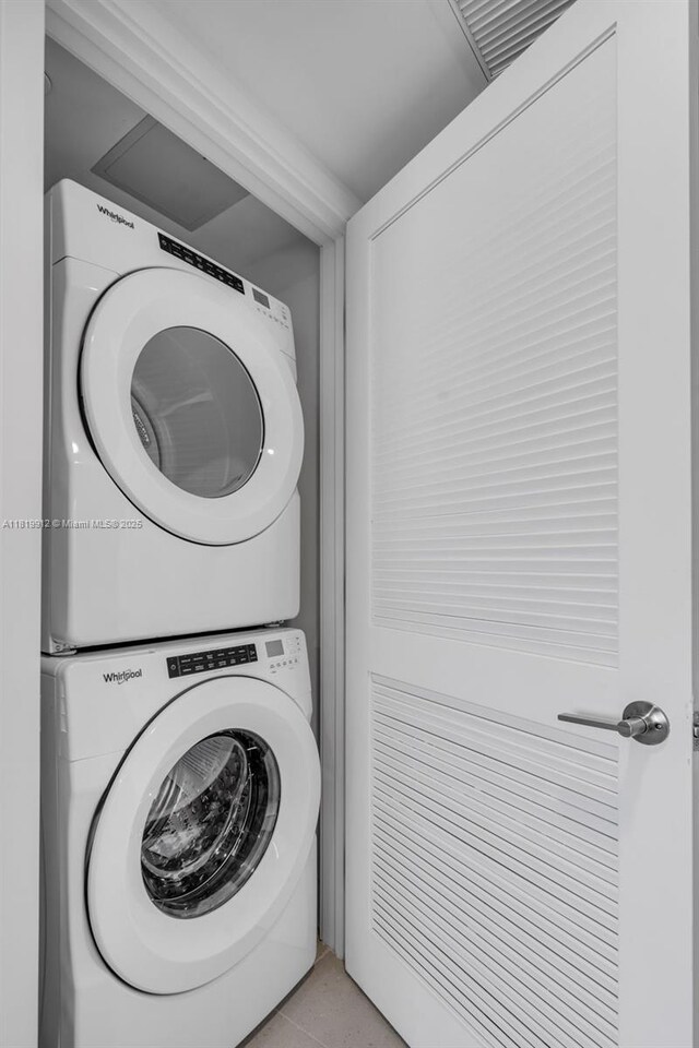 601 NE 6th St Unit 3709, Miami, FL 33132 - laundry room featuring stacked washer / drying machine