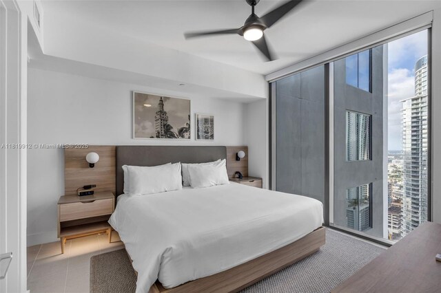 601 NE 6th St Unit 3709, Miami, FL 33132 - bedroom with multiple windows, a ceiling fan, and access to outside