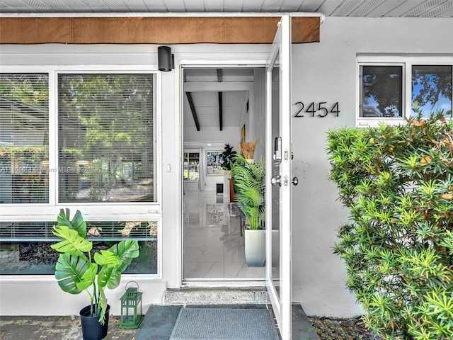 2454 W Nassau Ln, Fort Lauderdale, FL 33312 - doorway to property featuring stucco siding