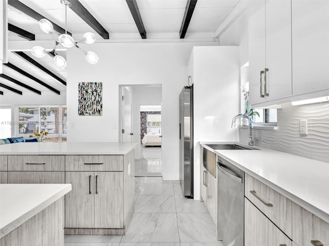 2454 W Nassau Ln, Fort Lauderdale, FL 33312 - kitchen with appliances with stainless steel finishes, beam ceiling, modern cabinets, a chandelier, and light countertops