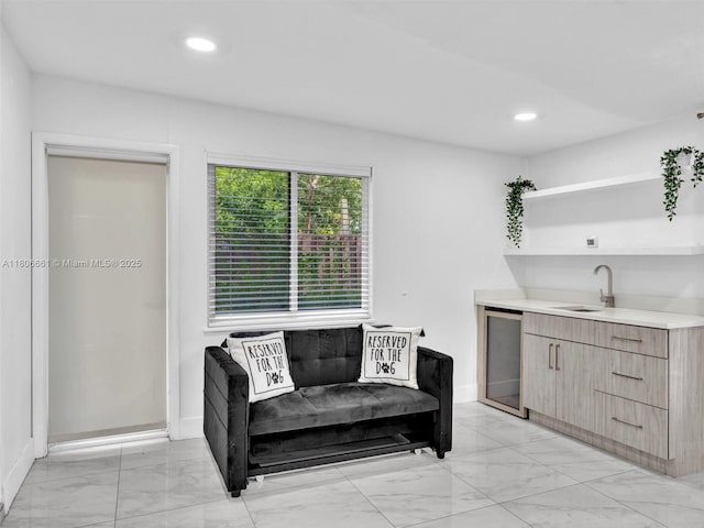 2454 W Nassau Ln, Fort Lauderdale, FL 33312 - sitting room featuring light marble finish flooring, wine cooler, and recessed lighting