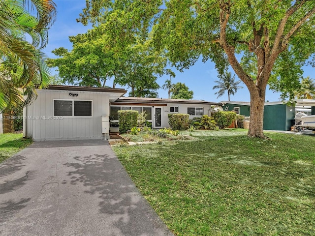 2454 W Nassau Ln, Fort Lauderdale, FL 33312 - view of front of home with a front lawn and driveway