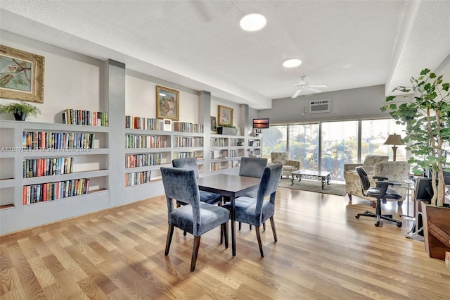 3233 NE 34th St Unit 611, Fort Lauderdale, FL 33308 - dining room featuring wood finished floors, ceiling fan, recessed lighting, and a wall mounted air conditioner