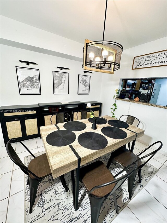 5975 SW 137th Ave Unit 902, Miami, FL 33183 - dining space with light marble finish flooring and a chandelier