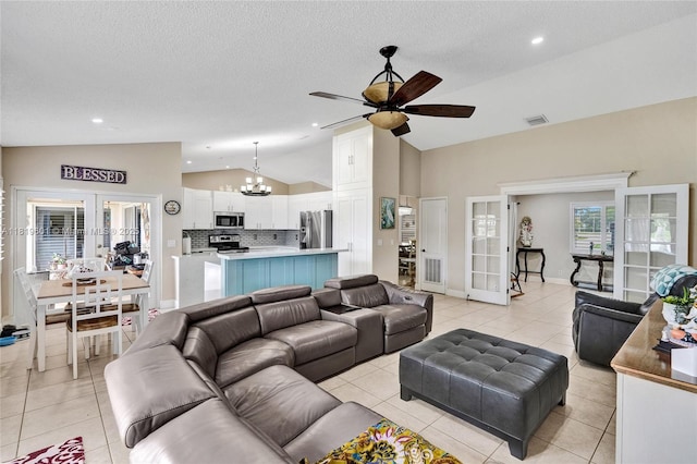 411 NW 201st Ave, Pembroke Pines, FL 33029 - living area with french doors, lofted ceiling, a chandelier, a ceiling fan, and light tile patterned floors