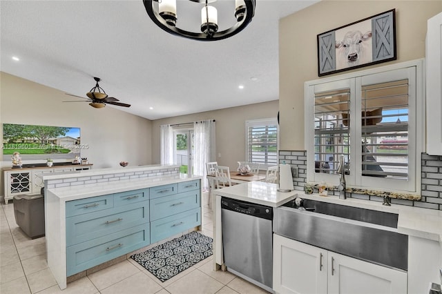 411 NW 201st Ave, Pembroke Pines, FL 33029 - kitchen featuring appliances with stainless steel finishes, a chandelier, backsplash, lofted ceiling, and light stone countertops