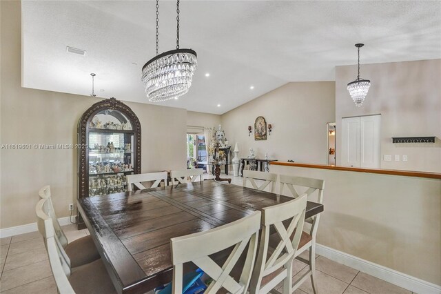 411 NW 201st Ave, Pembroke Pines, FL 33029 - dining space featuring light tile patterned floors, french doors, and lofted ceiling