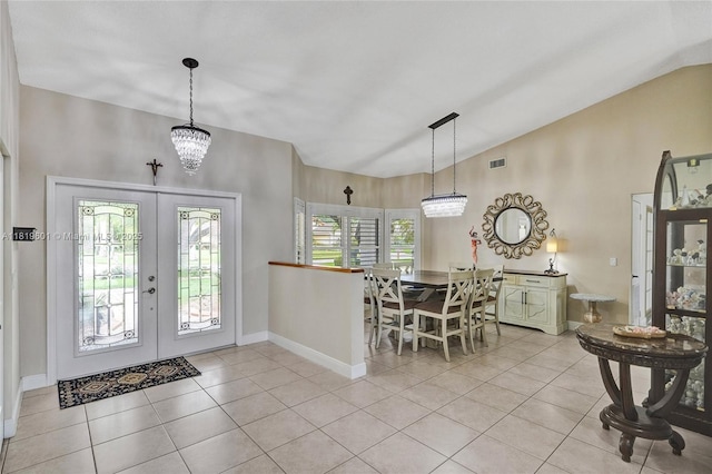 411 NW 201st Ave, Pembroke Pines, FL 33029 - foyer with lofted ceiling, french doors, light tile patterned floors, and a chandelier