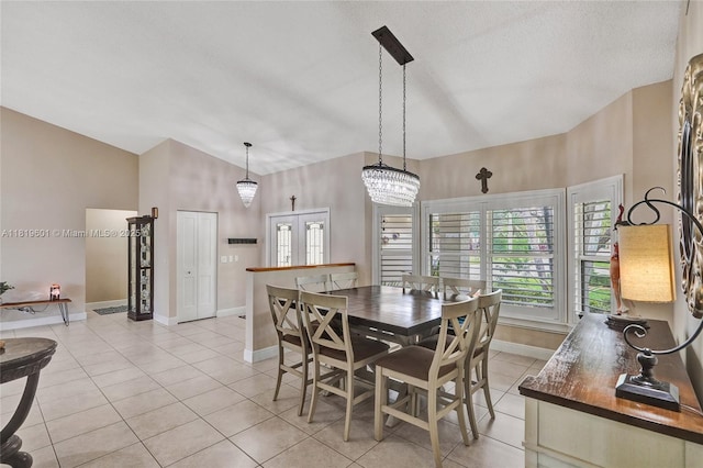 411 NW 201st Ave, Pembroke Pines, FL 33029 - dining space featuring light tile patterned flooring, high vaulted ceiling, and a textured ceiling