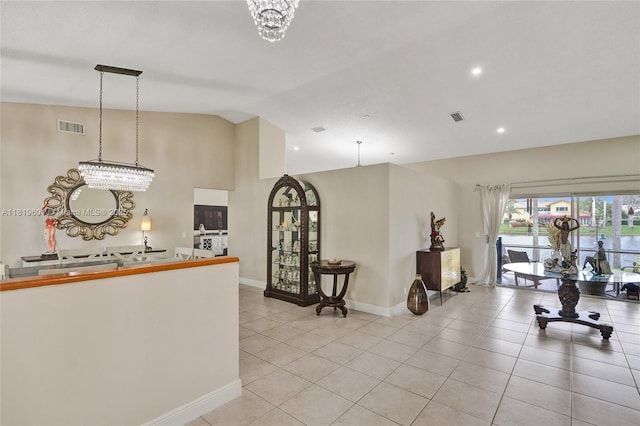 411 NW 201st Ave, Pembroke Pines, FL 33029 - kitchen with light tile patterned floors, vaulted ceiling, a chandelier, decorative light fixtures, and recessed lighting